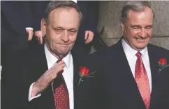  ?? CHRIS MIKULA / postmedia news files ?? Prime Minister Jean Chrétien and Finance Minister Paul Martin head into the Commons in 2001 on budget day.