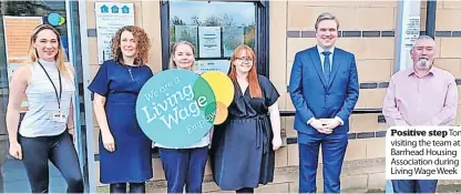  ?? ?? Positive step Tom visiting the team at Barrhead Housing Associatio­n during Living Wage Week