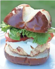  ?? ALYSHA WITWICKI ?? Shrimp burgers, fried like crab cakes, are served on pretzel buns.