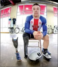  ?? Arkansas Democrat-Gazette/JOHN SYKES JR. ?? Jason Macom is pictured with the prosthetic leg he wears when walking (left) and the customized one he uses when on the bike.