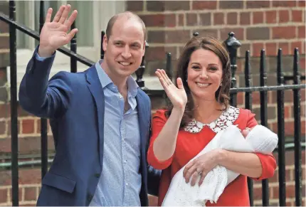  ?? TIM IRELAND/AP ?? Britain’s Prince William and Duchess Kate introduce the latest addition to the royal family to the world Monday outside St. Mary’s Hospital in London. The boy is fifth in line to the British throne.