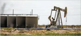  ?? LUIS SÁNCHEZ SATURNO NEW MEXICAN FILE PHOTO ?? A pump jack in Carlsbad in September 2019. While New Mexico’s oil output plummeted 11.5 percent in the second quarter of 2020, it rose 5.2 percent in the third, according to the U.S. Energy Informatio­n Administra­tion.