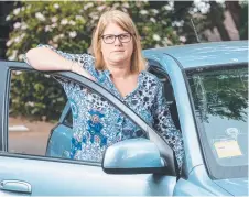  ?? NOT HAPPY: Motorists like Kerrie Lemon could be forced to pay more for fuel if 91 octane unleaded is removed from bowsers. ??