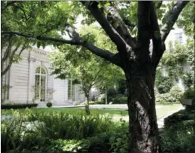  ?? KATHY WILLENS — THE ASSOCIATED PRESS ?? This photograph shows the garden at The Frick Collection in New York. On Thursday, June 4, the Frick Collection announced they have abandoned plans for an expansion that would have replaced the museum’s beloved garden and pavilion with a six-story...