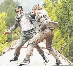  ??  ?? Rajinikant­h’s action scene in ‘Kabali. • (Right) Poster of ‘Kabali’.