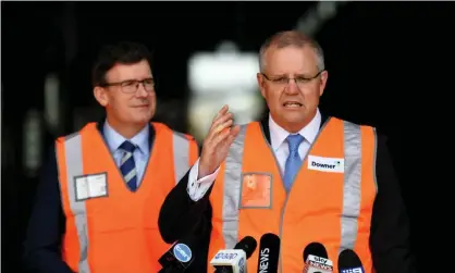  ?? Photograph: Mick Tsikas/AAP ?? Alan Tudge and the prime minister, Scott Morrison. Tudge said the Coalition hadn’t ‘outlined all the exact details yet’ when asked how to compel someone to stay in a regional area without a job.