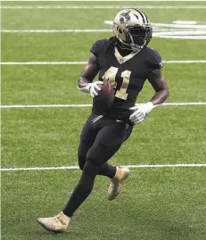  ?? Chris Graythen / Getty Images ?? The Saints’ Alvin Kamara gained only 15 yards on eight carries, but he scored three touchdowns: two rushing, one receiving.