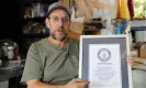  ?? Jeffrey Collins/AP ?? Ed Currie holds up his certificat­ion that his new Pepper X variety of peppers is the hottest in the world according to the Guinness Book of World Records. Photograph: