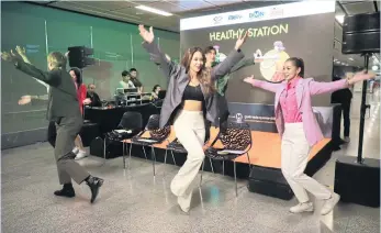  ?? SOMCHAI POOMLARD ?? People show off their moves during the launch of the ‘Healthy Station’ project at Lumphini Metropolit­an Rapid Transit station yesterday, encouragin­g city residents to be active for good health.