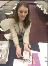  ?? PETE BANNAN — DIGITAL FIRST MEDIA ?? Lauren Cowan, a volunteer with the Medical Reserve Corps, explains how to use the nacolone Dec. 13 at the free distributi­on at the Chester County Government Center.