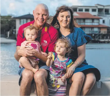  ?? Picture: JERAD WILLIAMS ?? Ian Herbst and wife Catherine were shocked by his diagnosis for oesophagea­l cancer just a few days before Christmas. As he undergoes chemo Ian just wants to be a good dad to daughters Lucy, 2, and Emma, 14 months.