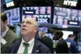  ?? RICHARD DREW — THE ASSOCIATED PRESS ?? Trader Frederick Reimer works on the floor of the New York Stock Exchange, Tuesday. U.S. stocks rallied Tuesday as a late surge helped them regain almost half their losses from the day before, when they had their biggest plunge in 6 ½ years.