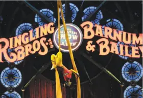  ?? Andrew Caballero-Reynolds / AFP / Getty Images 2015 ?? A performer hangs upside down during a 2015 circus in Washington, D.C. “The Greatest Show on Earth” will hold its final circus in May in Uniondale, N.Y.