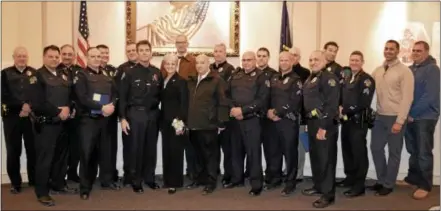  ?? SUBMITTED PHOTO ?? The Citizen’s Commendati­on Award was given to citizens for their actions in assisting two motorists who were unconsciou­s until police and medics arrived on scene, standing with West Chester police officers and former Mayor Carolyn Comitta, center.