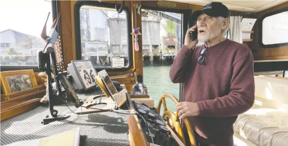  ?? ARLEN REDEKOP ?? Friends of False Creek director Zaida Schneider says that derelict boats can release “fish-killing toxins” like oil and antifreeze.