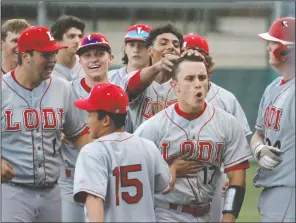  ?? DAVID WITTE/NEWS-SENTINEL ?? Lodi's Omar Plascencia (17) celebrates a two-run home run with his teammates during Lodi's 140 victory over Tokay at Zupo Field on May 7.