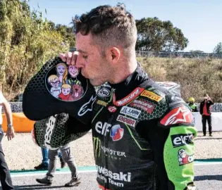  ??  ?? Below: Rea’s family didn’t travel with him this year, due to Covid, so he kept them on his chest protector