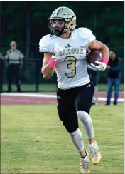  ?? File-TIM GOODBEE / For the Calhoun Times ?? Calhoun’s Brannon Spector looks for running room after taking a handoff during last Friday’s game.