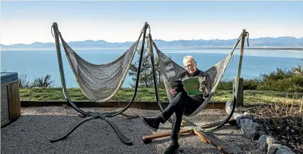  ?? BRADEN FASTIER/ STUFF ?? Clifftops Retreat in Ruby Bay is usually booked by overseas tourists but owner Bob Haswell has been surprised at the number of Kiwis booking to stay over the next month, during a time that is traditiona­lly quiet.