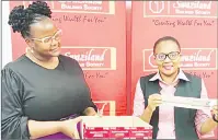  ?? ?? Mavimbela looks on as Nomhle Vilakati displays the second winner of the SBS New Year Relief competitio­n. (R) Sandile Langa, SBS Manager Digital Channels, also assisted with the draw while Mavimbela looks on.