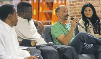  ?? Rebecca Droke/Post-Gazette ?? Anthony Parks, left, Julius Drake, Josh Inklovich and Pam Surano speak during the Repair the World Pittsburgh panel discussion on the role of the food industry in assisting ex-offenders reentering society.