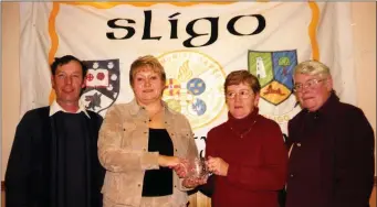  ??  ?? Noel Healy, Annie Harte and Eileen Healy being presented by the Most improved area award by Margaret Bolton. Sligo Community Games in 2003.