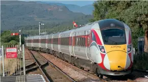  ?? ?? ↑ Class 800/1 units soon settled into Aberdeen and Inverness to London services, becoming part of the daily Highland railway scene. No. 800104 shows an unintended livery variation when photograph­ed departing Kingussie with the Up Highland Chieftain on September 17, 2020.