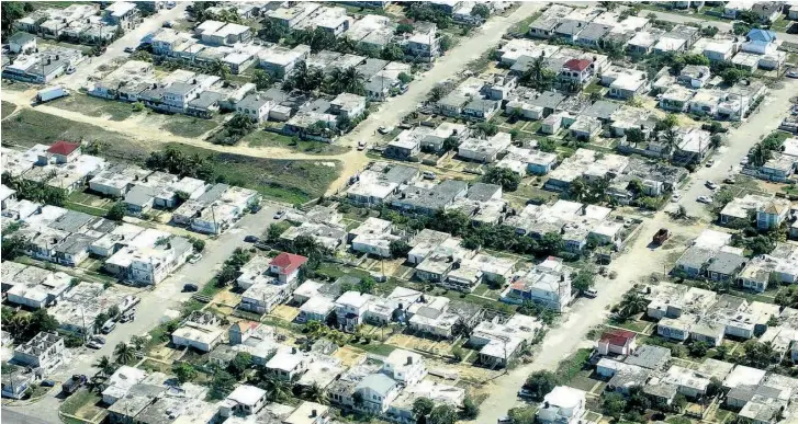 ??  ?? An aerial view of a housing estate in Portmore