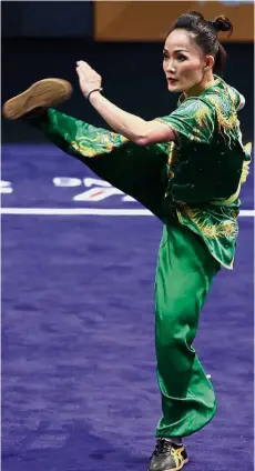  ??  ?? Serious business: Diana Bong executing her routine in the women’s nanquan at the Kuala Lumpur Convention Centre yesterday.