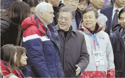  ?? AP PHOTO ?? WAITING FOR KIM: Vice President Mike Pence, center left, and South Korean President Moon Jae-in attend the ladies’ 500 meters short-track speedskati­ng at the Olympics in South Korea.