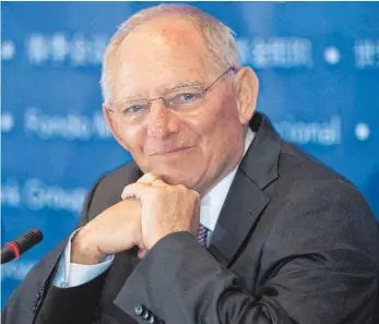  ?? FOTO: DPA ?? Wolfgang Schäuble hat Grund zur Freude: Im dritten Jahr in Folge vermeldet er ein Plus.