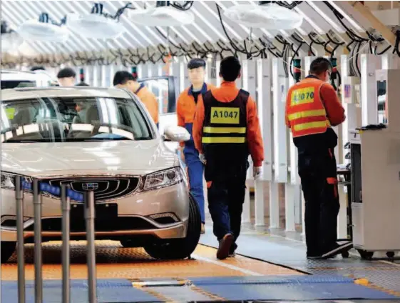 ??  ?? March 7, 2017: Workers test car performanc­e on a production line of Geely Automobile in Ningbo City, Zhejiang Province. The Chinese automaker actively expanded internatio­nal cooperatio­n and sold more than 1.5 million cars in 2018, up by 20 percent year- on-year, despite a struggling domestic car market. VCG