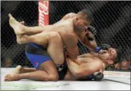  ?? JOHN LOCHER — THE ASSOCIATED PRESS ?? Alistair Overeem, left, fights Fabricio Werdum in a heavyweigh­t bout at UFC 213 on July 8 in Las Vegas.