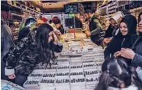  ?? Agence France-presse ?? Turkish customers look at jewellery on a stall in a market area of Eminonu District of Istanbul on Saturday.