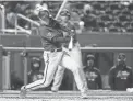  ?? ALEX BRANDON/AP ?? Andrew Young hits a grand slam during the second inning of the Diamondbac­ks’ game against the Nationals at Nationals Park on April 15.