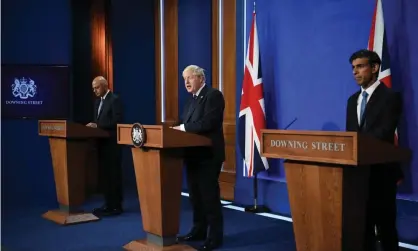  ?? Photograph: Neil Hall/EPA ?? Boris Johnson, flanked by Sajid Javid and Rishi Sunak, announces his health and social care plans.