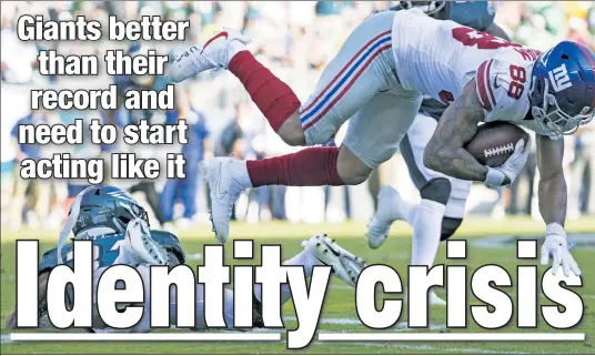  ?? Getty Images ?? THREE-LOSS CIRCUS: Rookie tight end Evan Engram is tackled after making a catch in the fourth quarter of a Week 3 loss to the Eagles as the Giants fell to 0-3 to start the season.