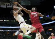  ?? LYNNE SLADKY — THE ASSOCIATED PRESS ?? Cavaliers guard Jordan Clarkson is fouled by Heat center Hassan Whiteside during the first half March 8 in Miami.