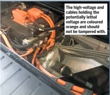  ??  ?? The high-voltage and cables holding the potentiall­y lethal voltage are coloured orange and should not be tampered with.