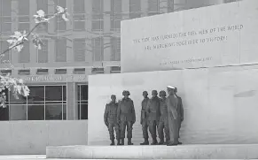  ?? SUSAN WALSH/ AP ?? A view of the new Dwight D. Eisenhower Memorial, which consists of two sets of bronze statues, in Washington, D. C.