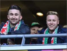  ??  ?? Kevin O’Connor and Seán Maguire (left) supporting their former club Cork City at the FAI Cup final in the Aviva Stadium on Sunday.