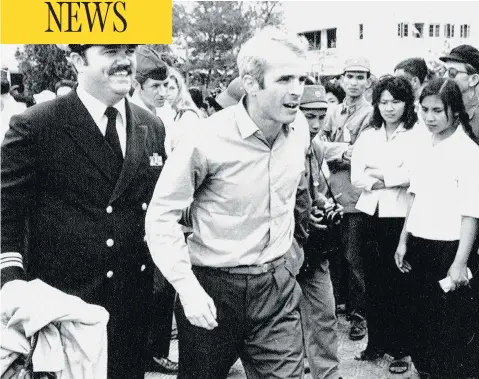  ?? HORST FAAS / THE ASSOCIATED PRESS FILES ?? John McCain, who was captured while serving in the Vietnam War, is escorted to the airport in Hanoi, Vietnam in 1973 after his release.