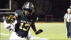  ?? Eddy Martinez/For The Signal ?? Golden Valley’s Johnathan Kaelin scores a touchdown against Bishop Diego on Friday at Canyon High School. The Grizzlies lost, 28-14.