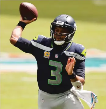  ?? GETTY IMAGES ?? Seahawks QB Russell Wilson leads the NFL with 26 touchdown passes and a 120.8 passer rating.