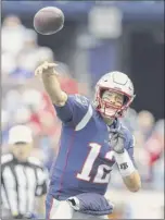  ?? Maddie Meyer / Getty Images ?? Tom Brady throws a pass in the first half against Houston last Sunday during the Patriots’ season opener.