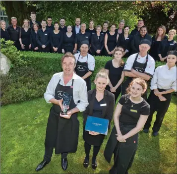  ??  ?? Evan Doyle and the staff of Brooklodge and Macreddin Village with the hotel’s latest award, the Luxury Travel Guide’s 2018 Luxury Eco-Friendly Hotel of the Year.