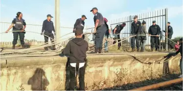  ??  ?? POLICE at Netreg station yesterday, where copper cable measuring 3km was cut down by thieves. | SUPPLIED