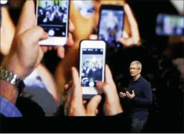  ?? ASSOCIATED PRESS FILE ?? Apple CEO Tim Cook announces the new iPhone 7 on Sept. 7 in San Francisco. The original iPhone was introduced a decade ago and proved to be a ground-breaking device.