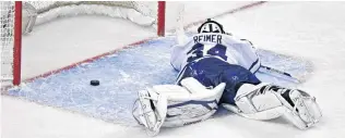  ?? AP PHOTO ?? Toronto Maple Leafs goalie James Reimer lays on the ice after getting beat on the game winning goal by Boston Bruins centre Patrice Bergeron during overtime in Game 7 of their NHL hockey Stanley Cup playoff series in Boston, Monday, May 13, 2013.