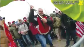  ?? METROPOLIT­AN POLICE DEPARTMENT VIA AP ?? This still frame from Metropolit­an Police Department body worn camera video shows Thomas Webster, in red jacket, at a barricade line at on the west front of the U.S. Capitol on Jan. 6, 2021, in Washington.